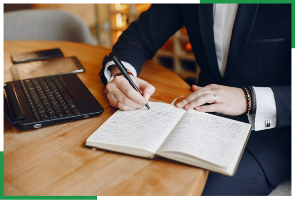 Businessman writing notes representing offshore document management, preparation and filing services USA