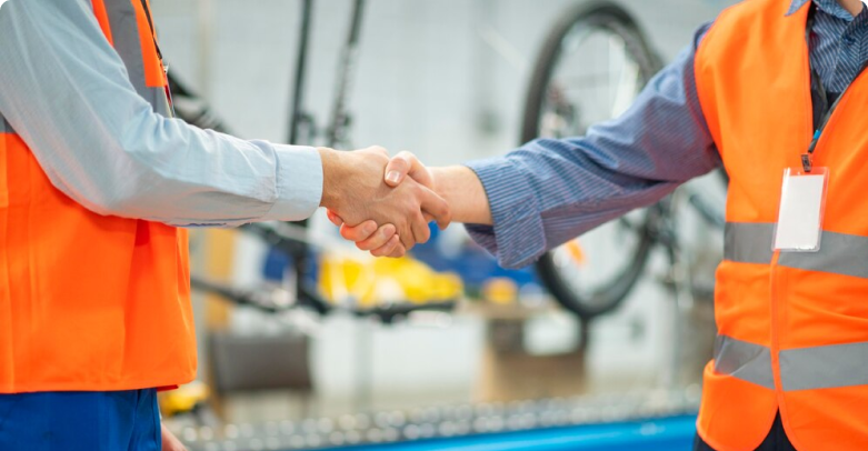 Professionals shaking hands symbolizing offshore manufacturing support, logistics and warehousing solutions USA