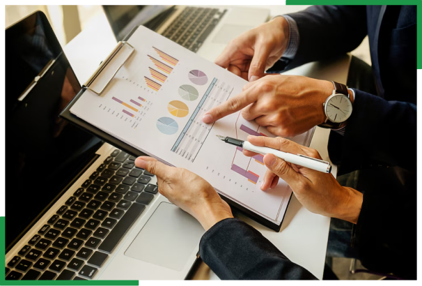 Professionals analyzing charts on tablet representing offshore administrative and secretarial support services USA